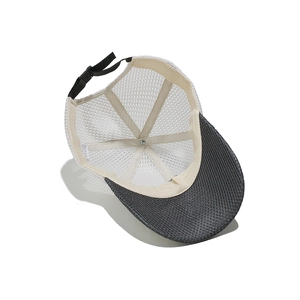 Detail of 100% polyester mesh cap with breathable weave and adjustable buckle strap