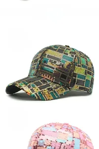Detail view of sparkly sequin baseball caps in black and pink checkered patterns