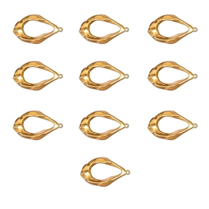 Detailed view of ten irregular teardrop gold charms with hammered texture for DIY jewelry
