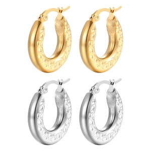 Thick stainless steel hoop earrings in gold and silver with textured relief pattern