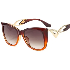Women's butterfly cat eye sunglasses with amber frames and gold hollow temples