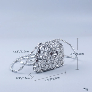 Macro detail of silver sequin woven mini bag showing size specs and metallic texture