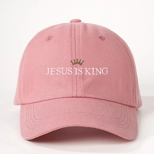 Pink cotton baseball cap with white Jesus Is King embroidery and crown icon
