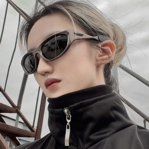 Y2K sporty cat eye sunglasses with translucent taupe frame and grey protective lenses