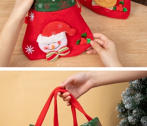 Detail of red felt Christmas gift bag with reindeer antlers and snowman applique