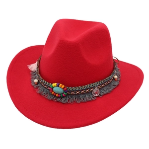 Red felt cowboy hat with ethnic woven band, turquoise stone, and fringe tassels