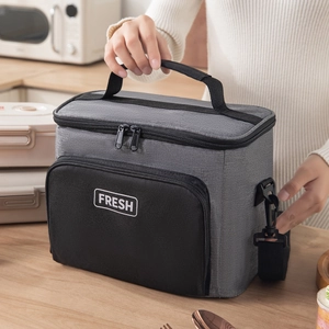 Insulated gray lunch bag with thick aluminum foil lining and adjustable shoulder strap