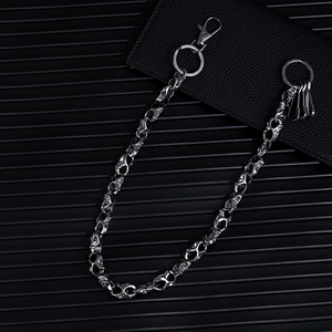 Detail of vintage silver skull metal pants chain with lobster clasp and industrial hooks