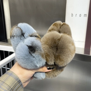 Close-up of soft plush hair claws in blue-grey and brown with fluffy fur texture