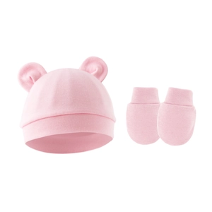 Detailed view of pink knitted baby hat with 3D bear ears and matching anti-scratch gloves
