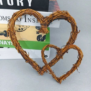Close-up of double heart-shaped wicker wreaths in natural brown for rustic home decor