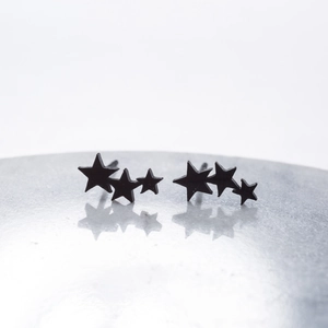 Minimalist matte black stainless steel triple star stud earrings in a gradient design