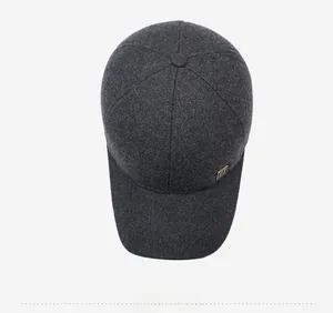 Top down view of dark grey wool blend baseball cap with a gold side plaque detail