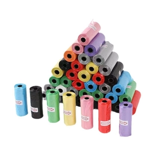 Pyramid stack of colorful portable dog poop bags in various vibrant shades and rolls