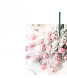 Pink Christmas ornaments with glossy and matte textures on a white mesh background