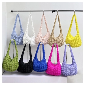 Close-up of quilted bubble puff shoulder bags in ten vibrant colors for women