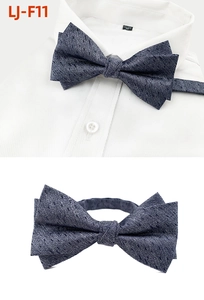 Detail of grey-blue jacquard bow tie with adjustable neck strap for formal suits