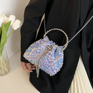 Chic light blue sequin bucket bag with round silver metal handle and chain strap