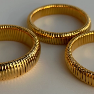 Vintage 18k gold plated Tubogas stretch spiral bracelets with polished finish