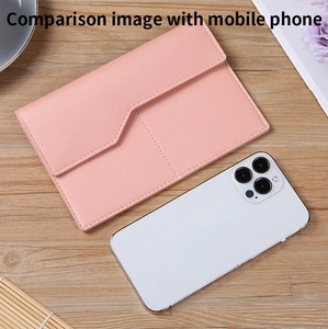 Pink PU leather wallet shown next to a smartphone to demonstrate the portable size