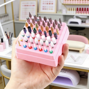 Pink 49-hole nail drill bit storage box with assorted ceramic and tungsten steel bits