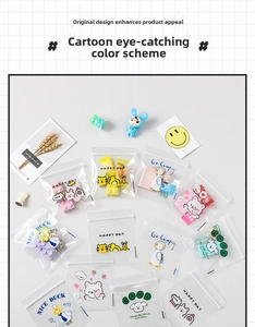Macro shot of cute cartoon clear zipper bags for organizing small toys and stationery