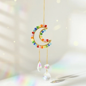 Detail of gold crescent moon and star suncatcher with K9 crystal prisms and colorful beads