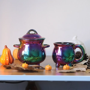 Rainbow plated ceramic witch cauldron and cauldron mug with autumn pumpkin decor