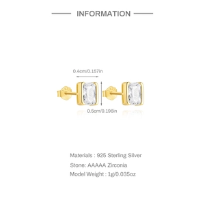 Macro shot of S925 sterling silver stamp on golden geometric stud earrings with zircon