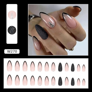 French black tip almond press-on nails set with glitter lines and rhinestone accents
