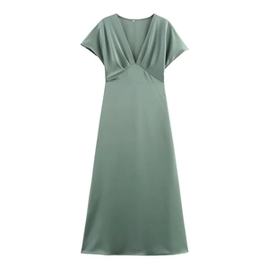 Macro detail of sage green satin midi dress showing V-neck and ruched fabric texture