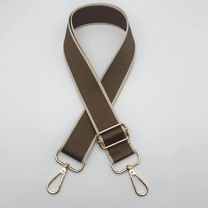 Close-up of adjustable 3.8cm wide coffee brown bag strap with gold lobster clasps