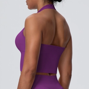 Detail of purple seamless knitted sports bra showing ribbed texture and halter neck design