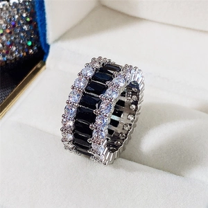 Macro shot of S925 sterling silver wide band ring with black and white zircon crystals