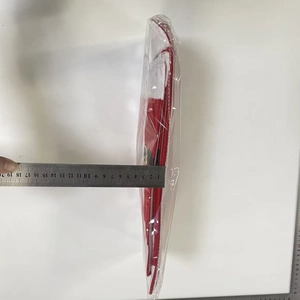 Close-up measurement showing the 2.5cm thickness of the red Christmas handle cover