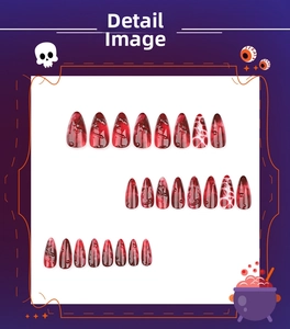 Detailed view of Halloween stiletto press-on nails with dark red marble blood patterns