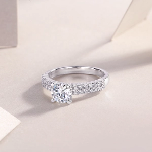 Macro view of 1 carat round-cut moissanite ring with double-row pavé diamonds