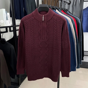 Close-up of wine red cable knit sweater featuring a premium half-zip stand collar design