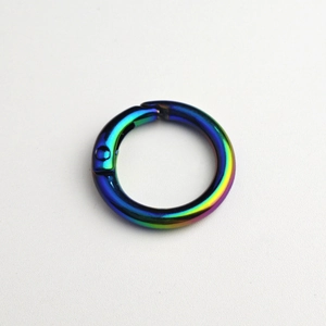 Macro view of iridescent rainbow metal spring ring buckle with gradient plating finish
