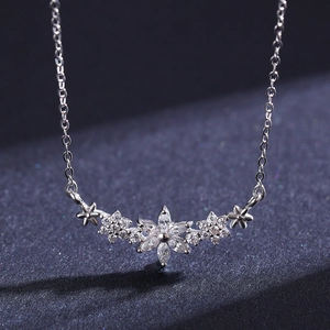Elegant S925 sterling silver flower necklace with sparkling zircon stones on a dark background