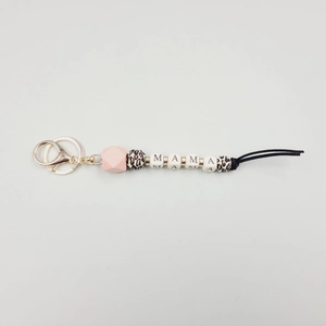 Detail of MAMA letter beads keychain with silicone leopard print beads and gold clasp
