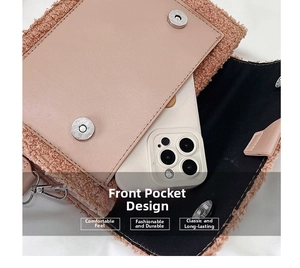 Detail view of pink plush crossbody bag featuring magnetic closure and functional front pocket