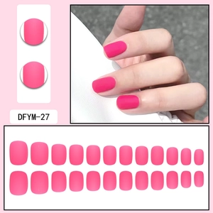 Detail of matte rose pink short square press-on nails with 24-piece sizing guide