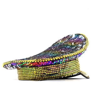 Rainbow sequin captain hat for parties with gold studs and braids on a white background