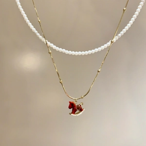 Gold plated necklace with red enamel horse pendant and micro-set zircon detail