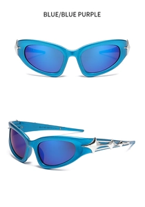 Close-up of Y2K cyberpunk sunglasses with silver star details on blue mirror lenses