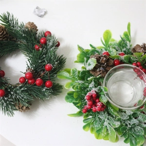 Christmas candle holder and pine needle wreath with red berries and faux snow decor