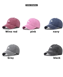 Group display of five vintage washed cotton baseball caps with squirrel embroidery