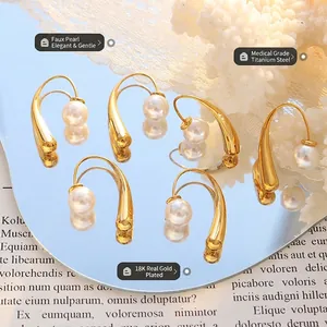Unique 18K gold plated titanium steel hoop earrings with faux pearl on mirror background