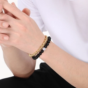 Men's double-layered bracelet featuring gold twist chain and black matte beads with marble accents